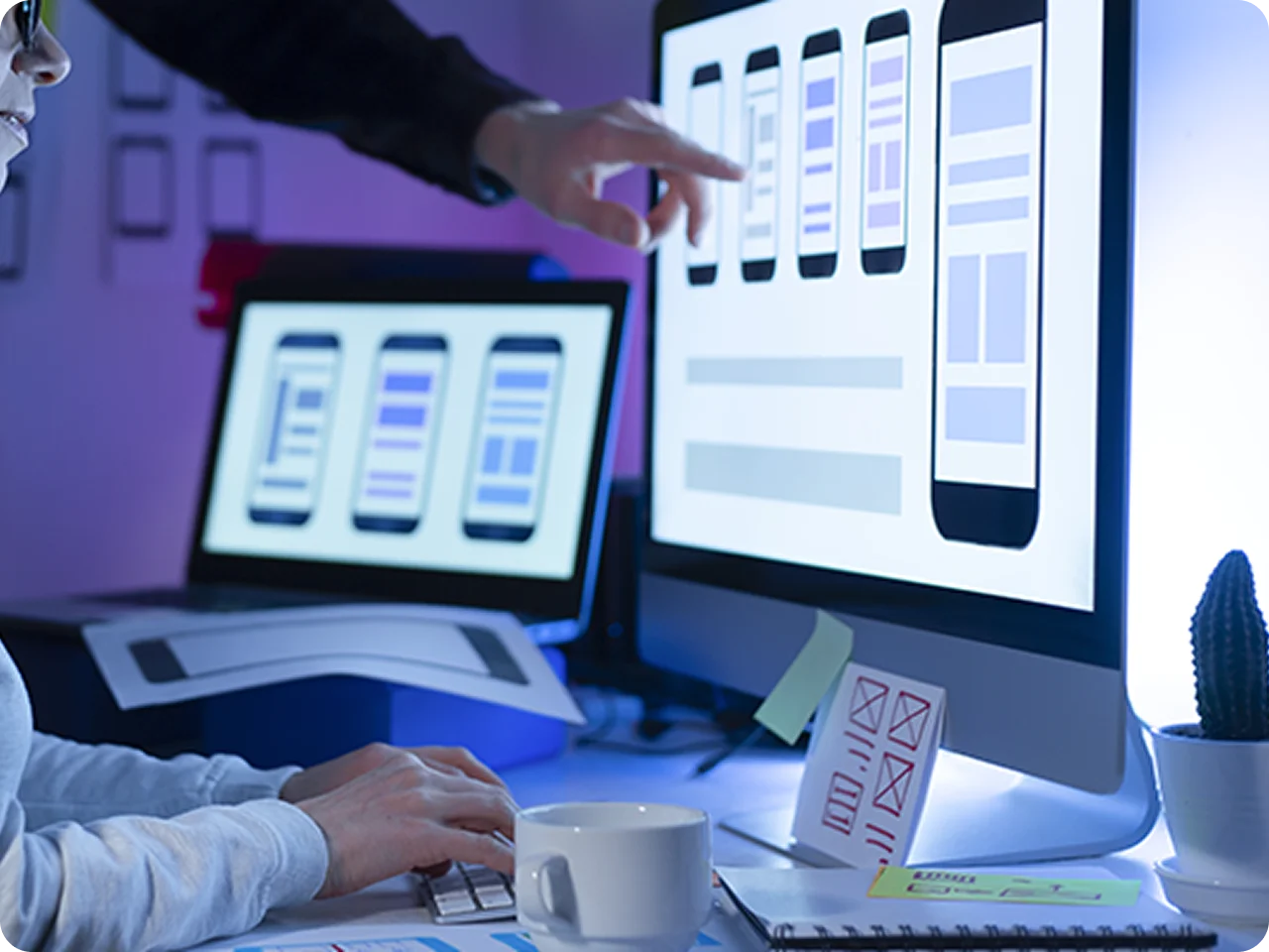UI/UX designers creating website prototypes